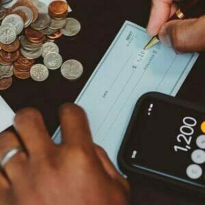 Image showing coins, a check, and calculator.