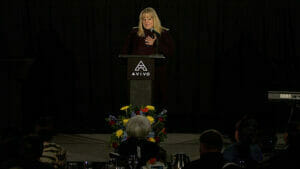 Avivo participant speaks at Avivo Night of Champions event.