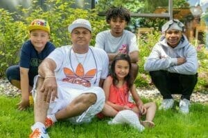 Avivo participant and his children after he reaches recovery at Avivo