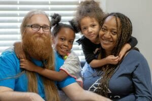 Takeerah and her family pose for the camera as they celebrate her success.