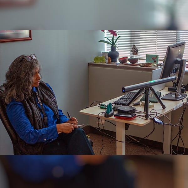 Bharati Acharya, mental health professional at Avivo, uses a modern EMDR setup at Avivo's Mental Health Clinic.