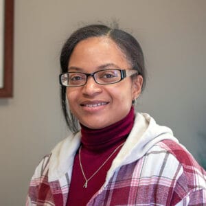 Amber, a successful Avivo career education participant, smiles for the camera.