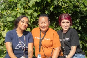 Three members of Avivo's Street Outreach Team poses for a photo.