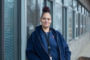 Mia, a successful Avivo participant from Avivo's treatment program with lodging, poses for a photo.