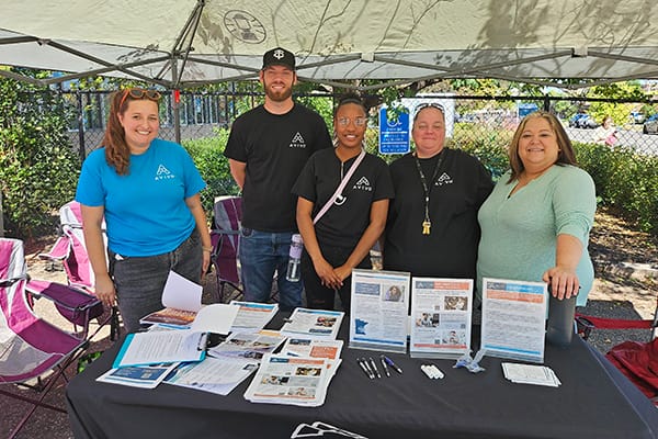 Avivo staff pose for a photo at an Avivo Resource/Hiring Fair